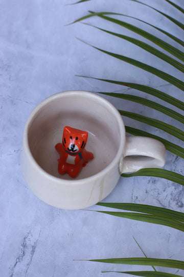 Ceramic cup with cat inside