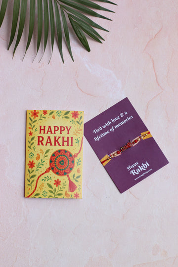 Colorful 'Happy Rakhi' card with a purple card featuring a Rakhi on a light pink background.